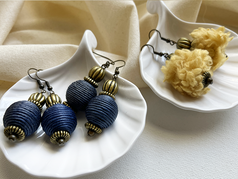 Navy cord-wrapped and yellow yarn-wrapped earrings