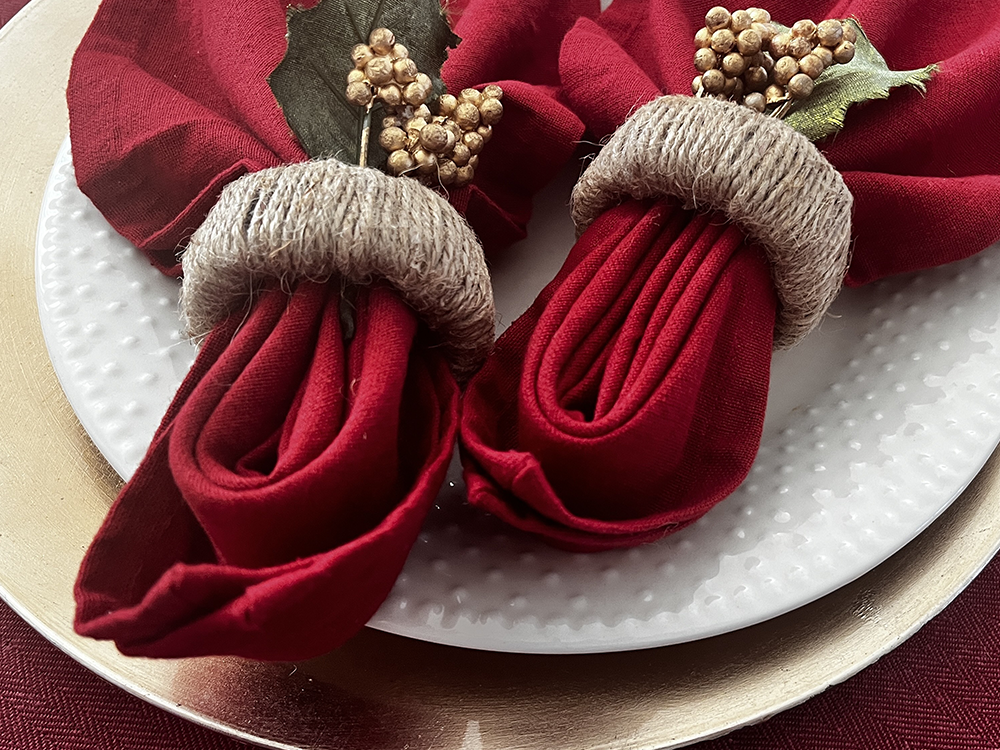 Red napkins with jute napkin rings