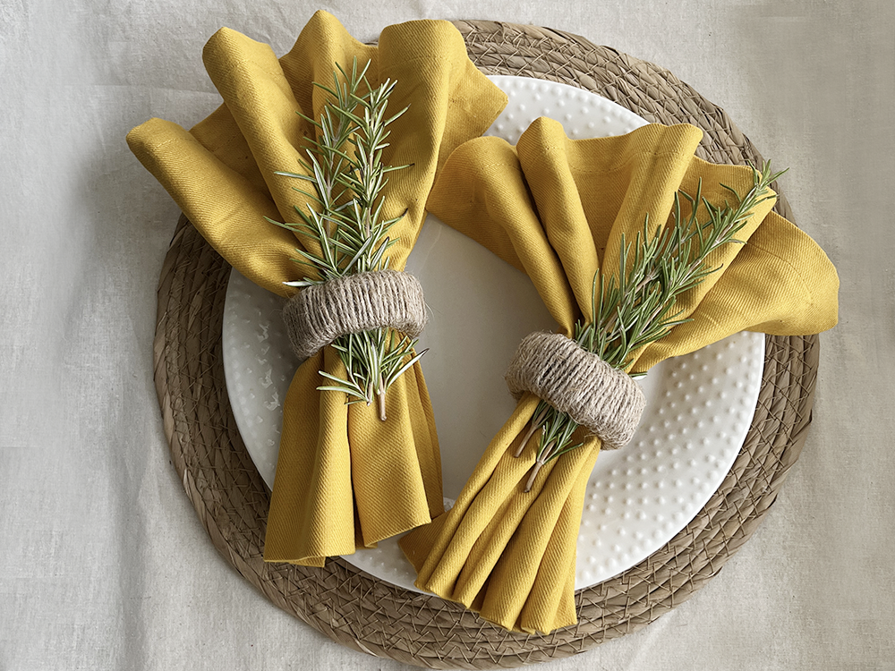 Yellow napkins with jute napkin rings
