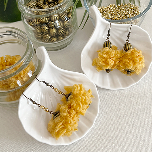 Two pairs of yellow yarn ball bead earrings